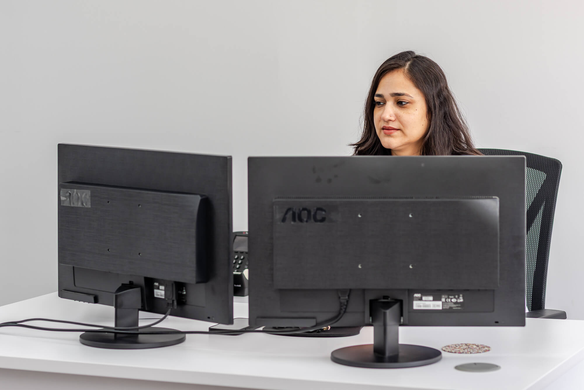 Gunjan Kataria working at her desk
