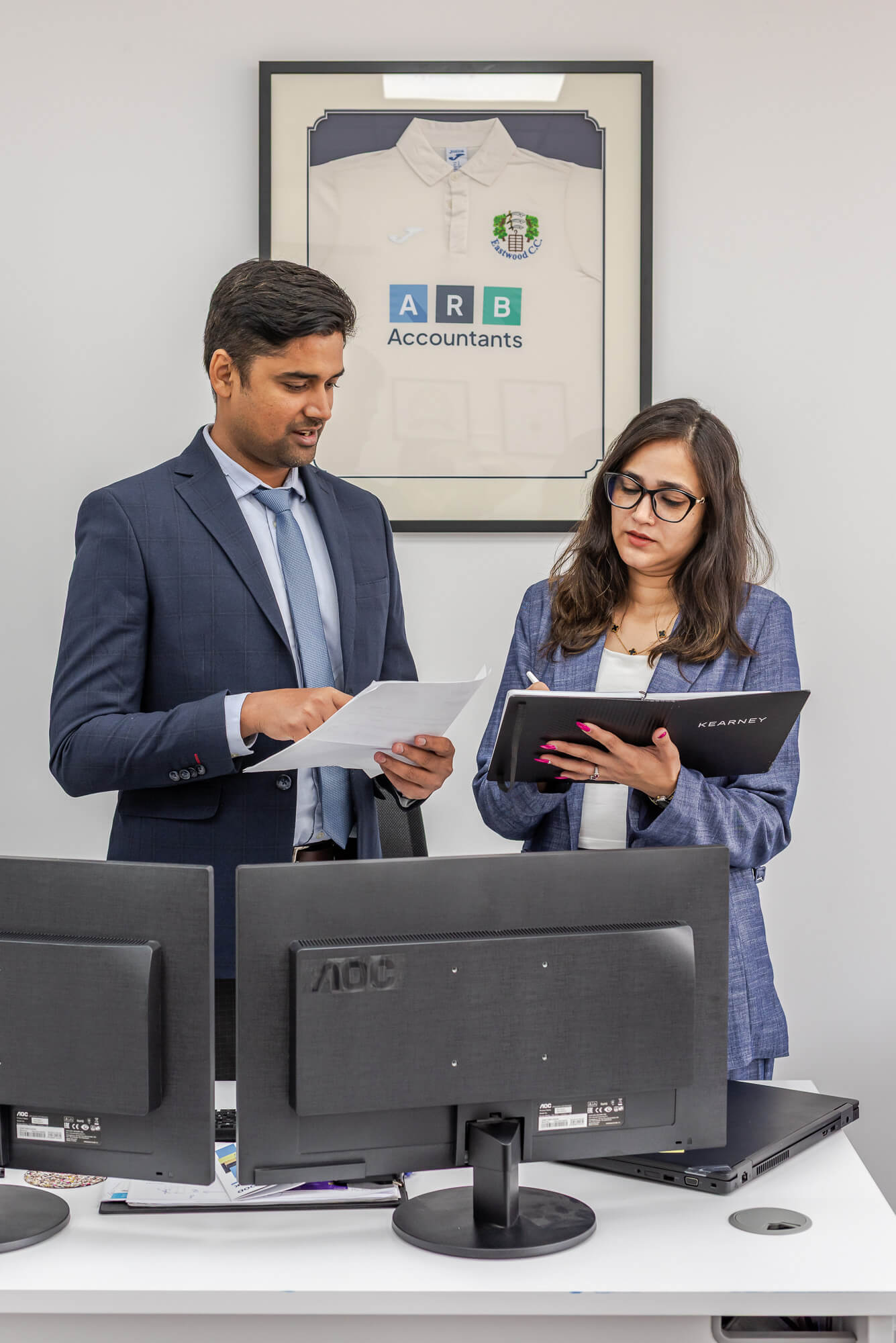 Team members reviewing documents together