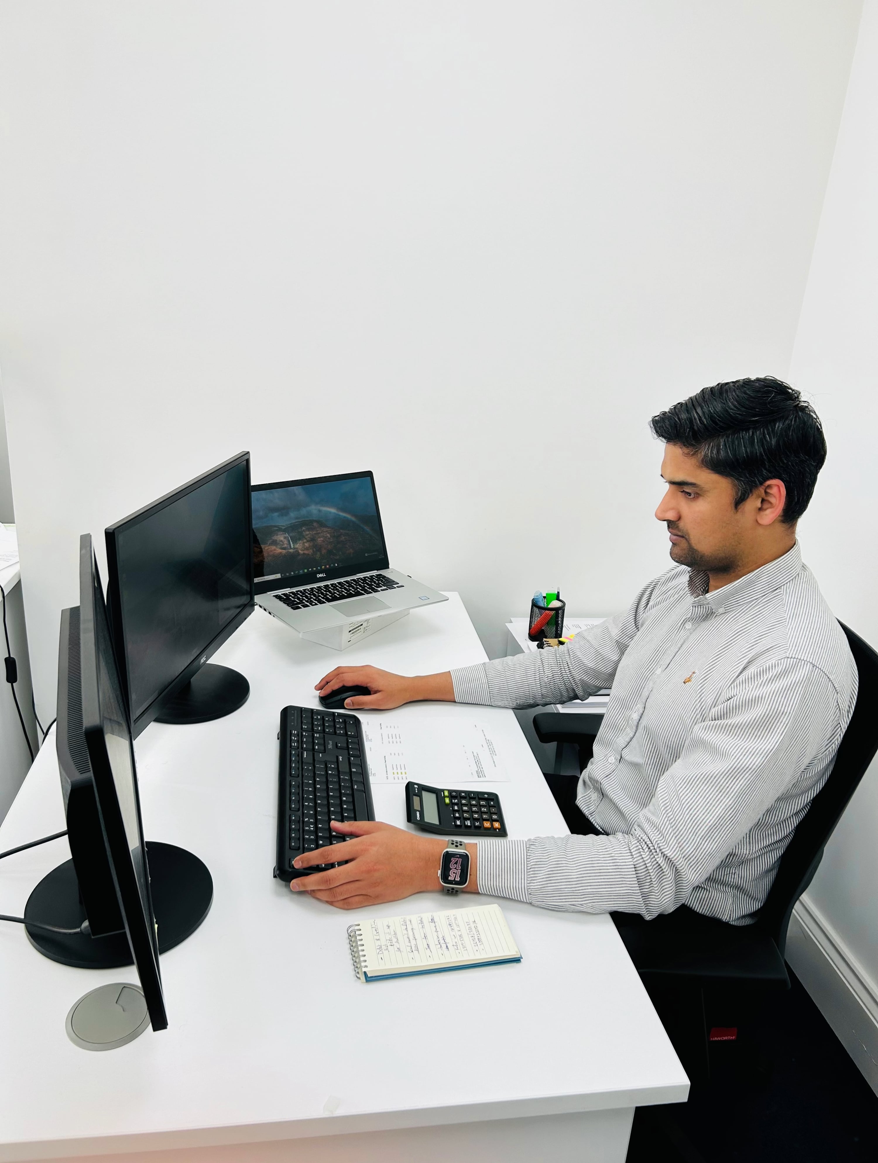Limited Company UK A man sitting at a desk, working to register a limited company UK